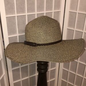 Womer’s Brown & Tan Floppy Sun Hat with Narrow Braided Faux Leather Band.